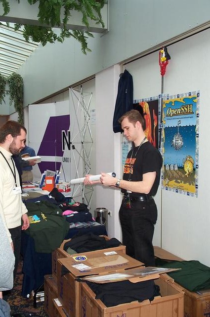 Wim Vandeputte promoting OpenBSD by selling CDs, shirts etc.